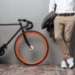 dressed-half-mens-body-standing-near-bicycle (1)